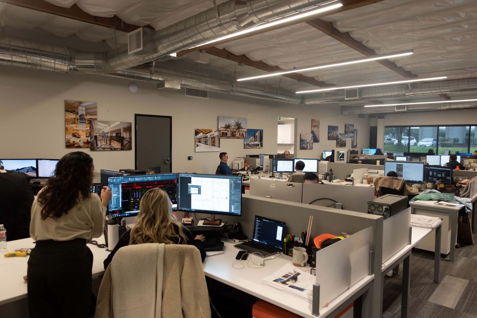 The ADC team collaborating on a project, one of the many things that makes the opportunities here some of the most fulfilling jobs in architecture and design.