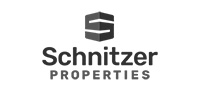 Logo of Schnitzer Properties featuring a stylized geometric shape above the company name in bold letters.