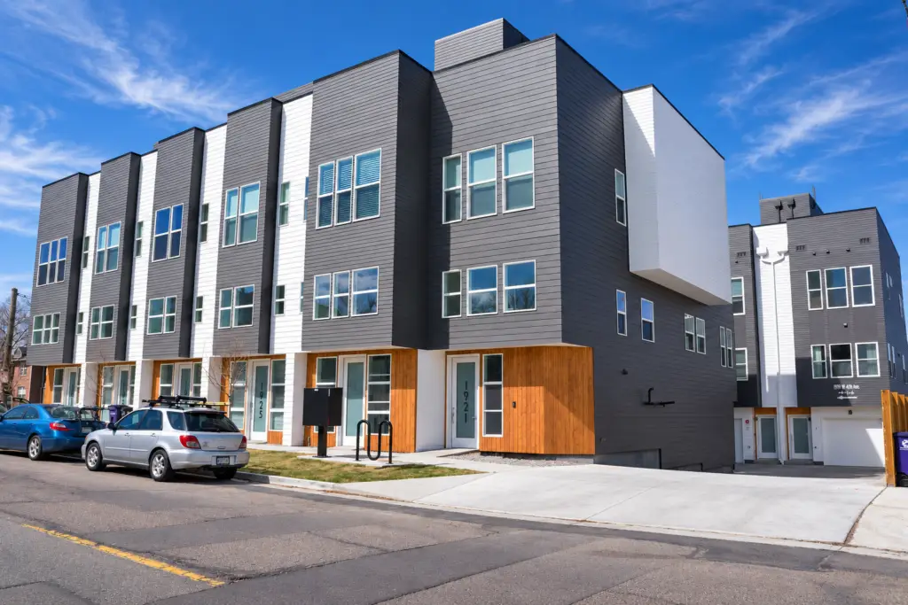1919 W 46th Townhomes in Denver with contemporary gray, white, and wood exterior finishes