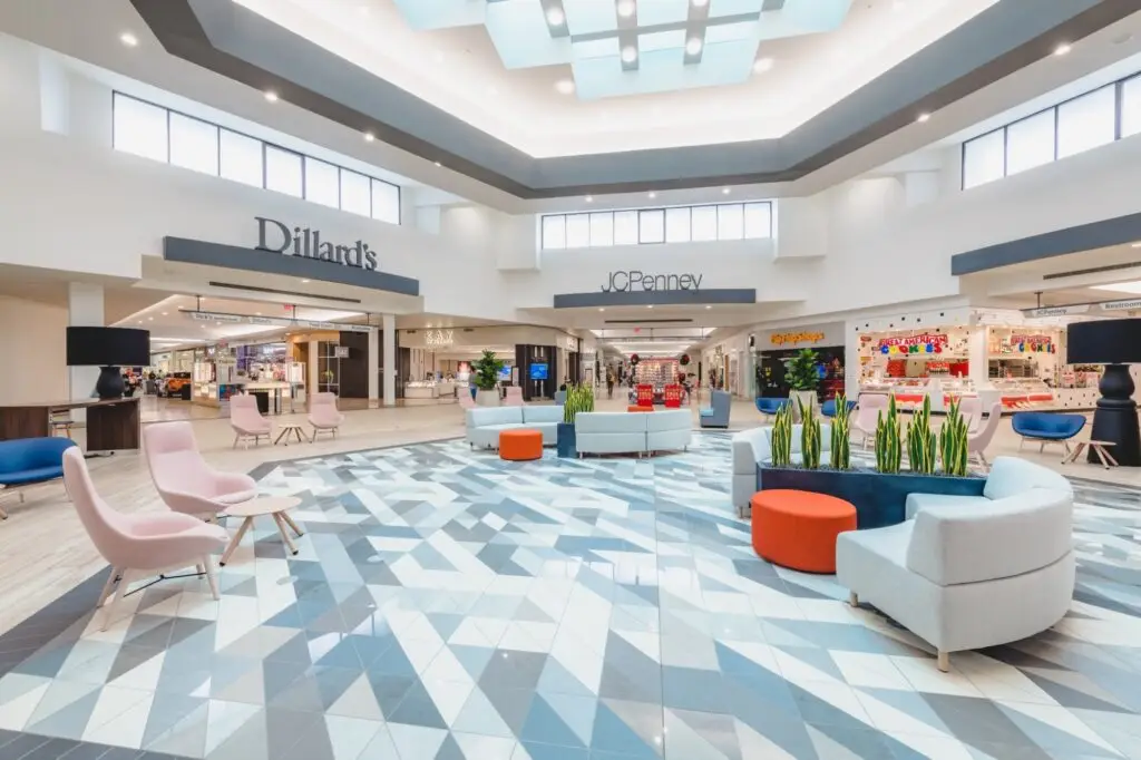 Renovated center court at Independence Mall in Wilmington, North Carolina, featuring custom geometric tile flooring and new furnishings by Architecture Design Collaborative.