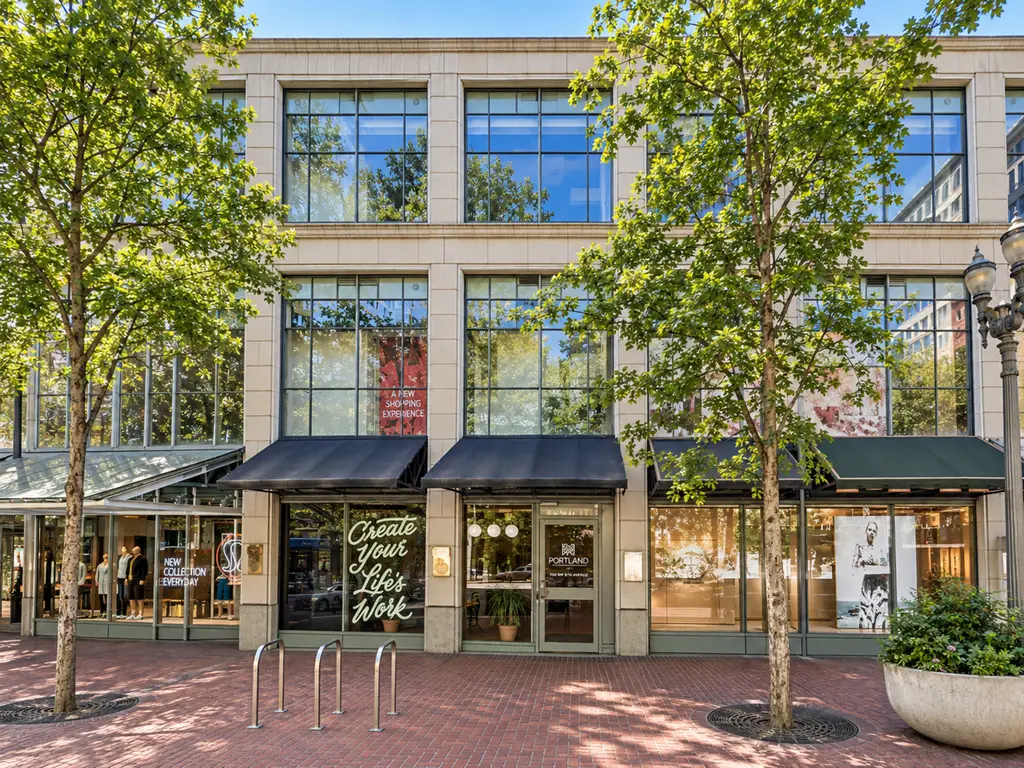Pioneer Place Portland street facade with storefronts, awnings, and brick sidewalk