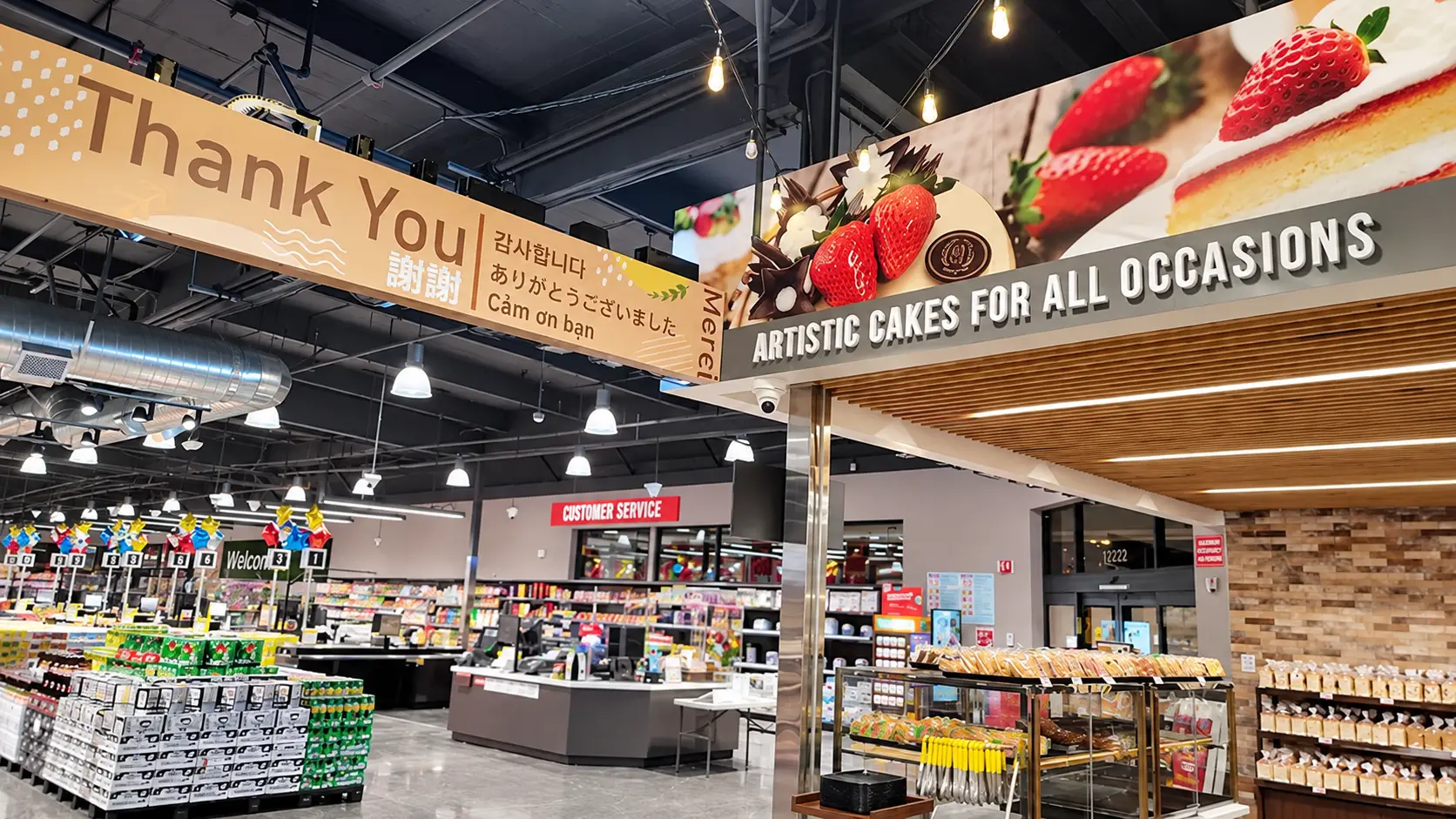 Bakery and checkout area at 99 Ranch Market Fremont, with cake graphics and a multilingual thank-you banner