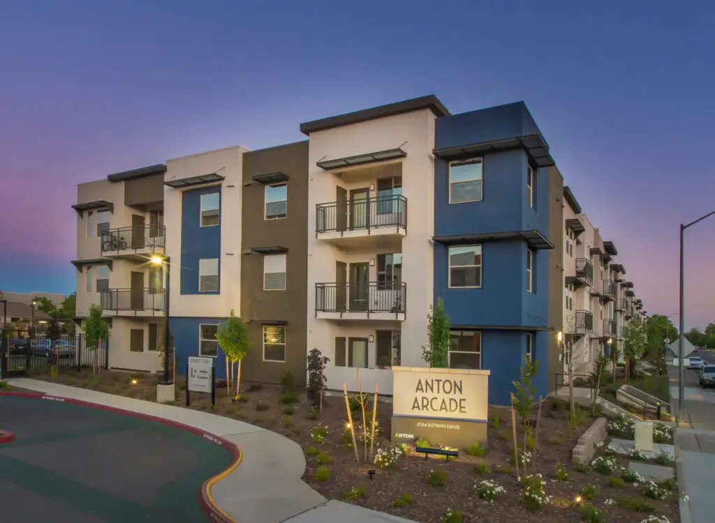 Anton Arcade affordable housing community in Sacramento with contemporary corner architecture and landscaped street frontage