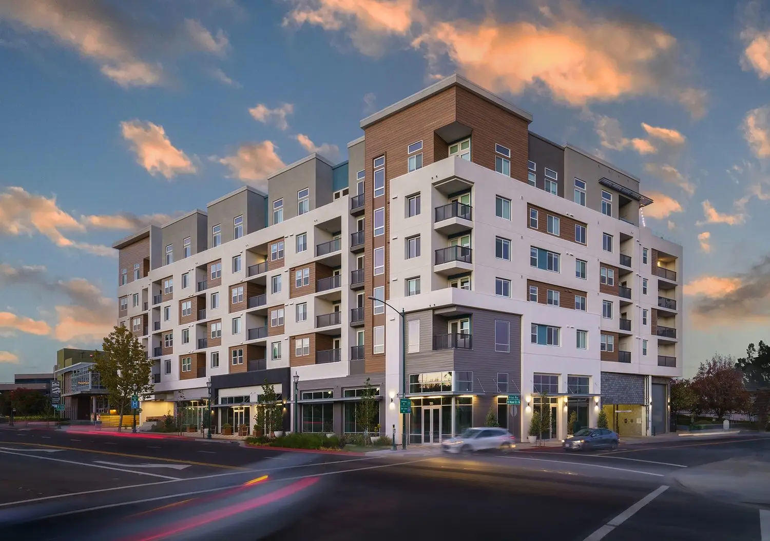 Anton NoMa mixed-use apartment community in Walnut Creek at dusk with contemporary architecture and ground-floor retail