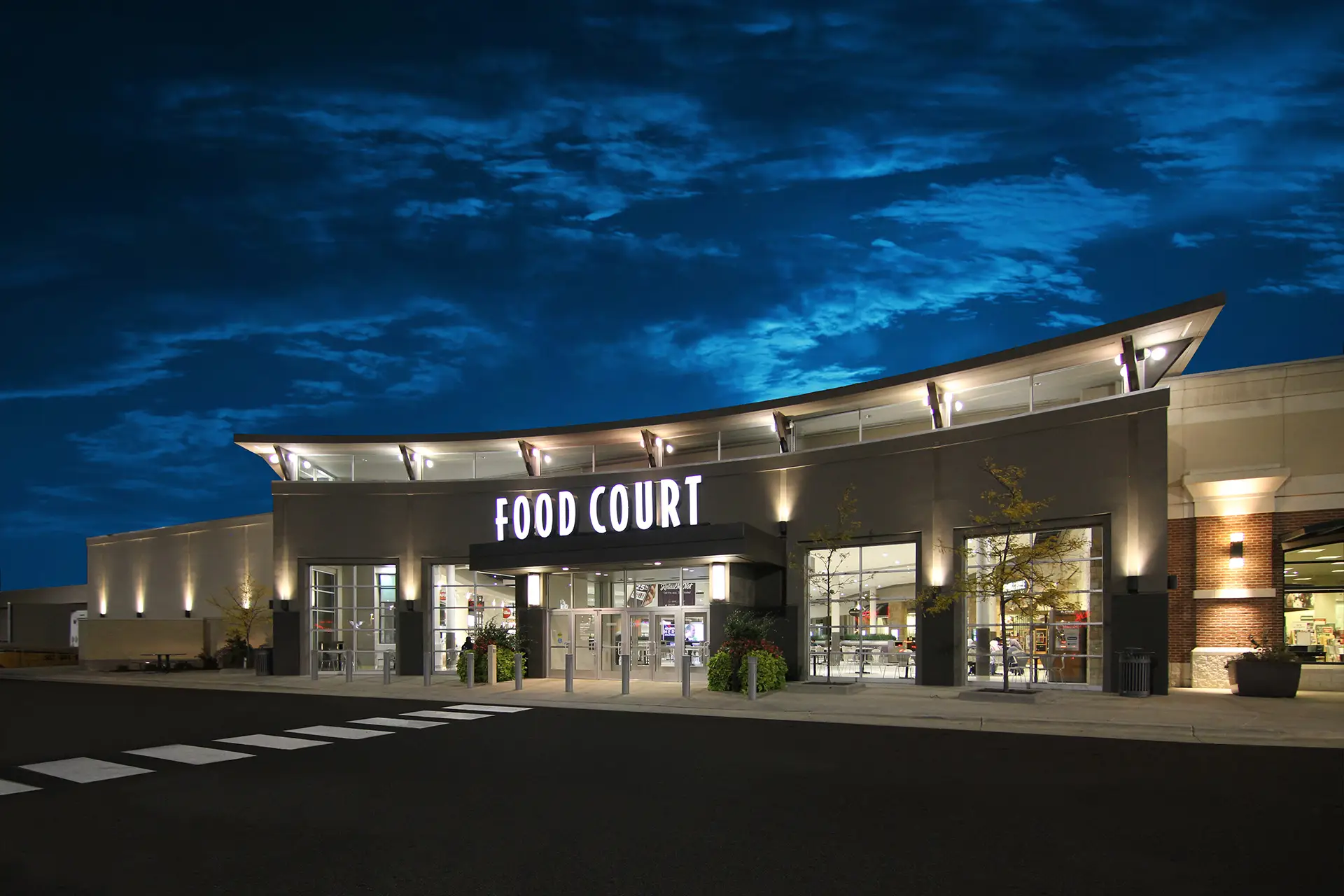 Apache Mall Rochester renovated common area with new flooring, lighting, and finishes