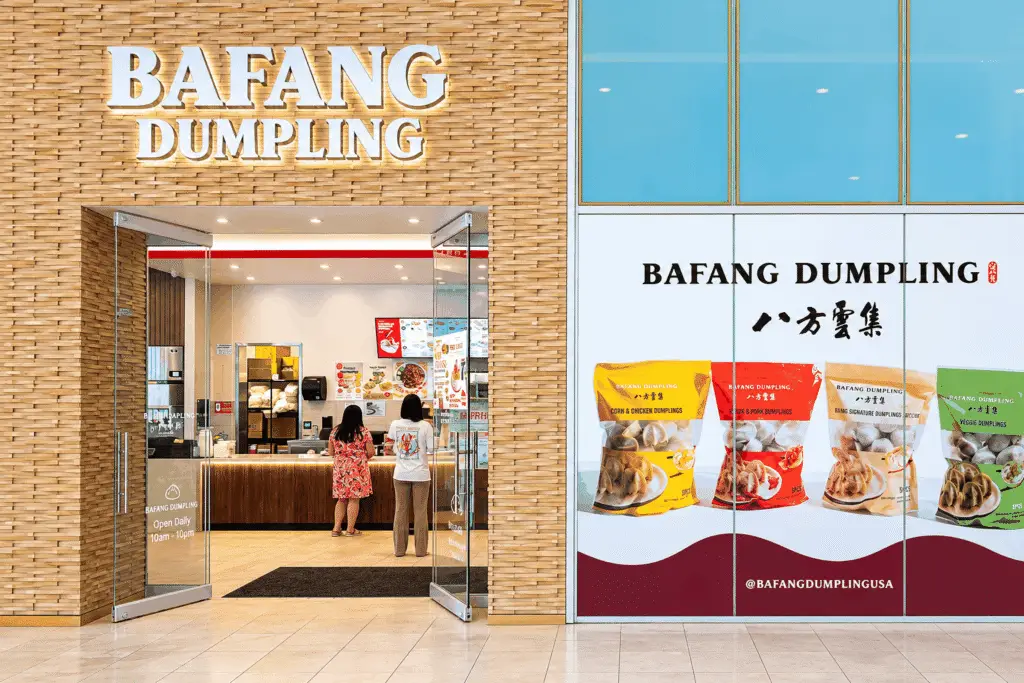 Bafang Arcadia restaurant interior with wood-slat feature, communal seating, and branded graphics