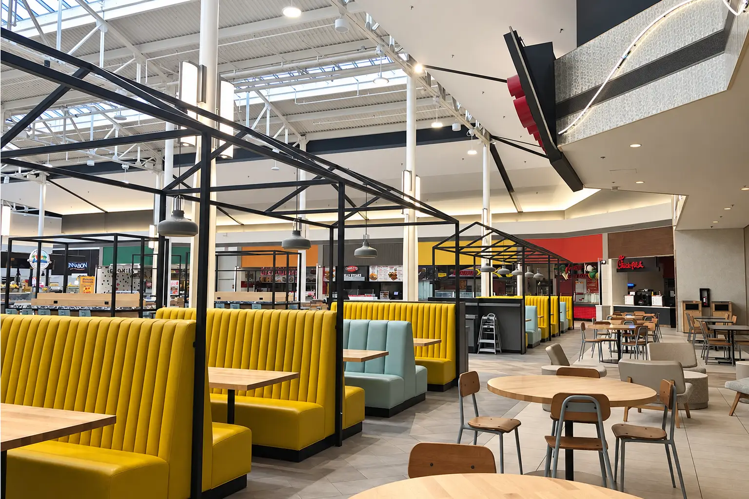Renovated Deerbrook Mall food court in Humble, Texas with custom seating and new finishes by Architecture Design Collaborative