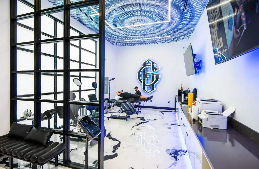 Grailed Gallery tattoo studio at Rodeo 72 in Whittier, California, with custom lighting, artwork, and private tattoo stations