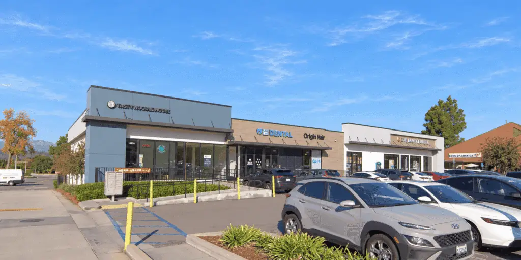 Tenant row at Hacienda Center with Tasty Noodle House, Kang & Lee Dental, Origin Hair, and parking in front