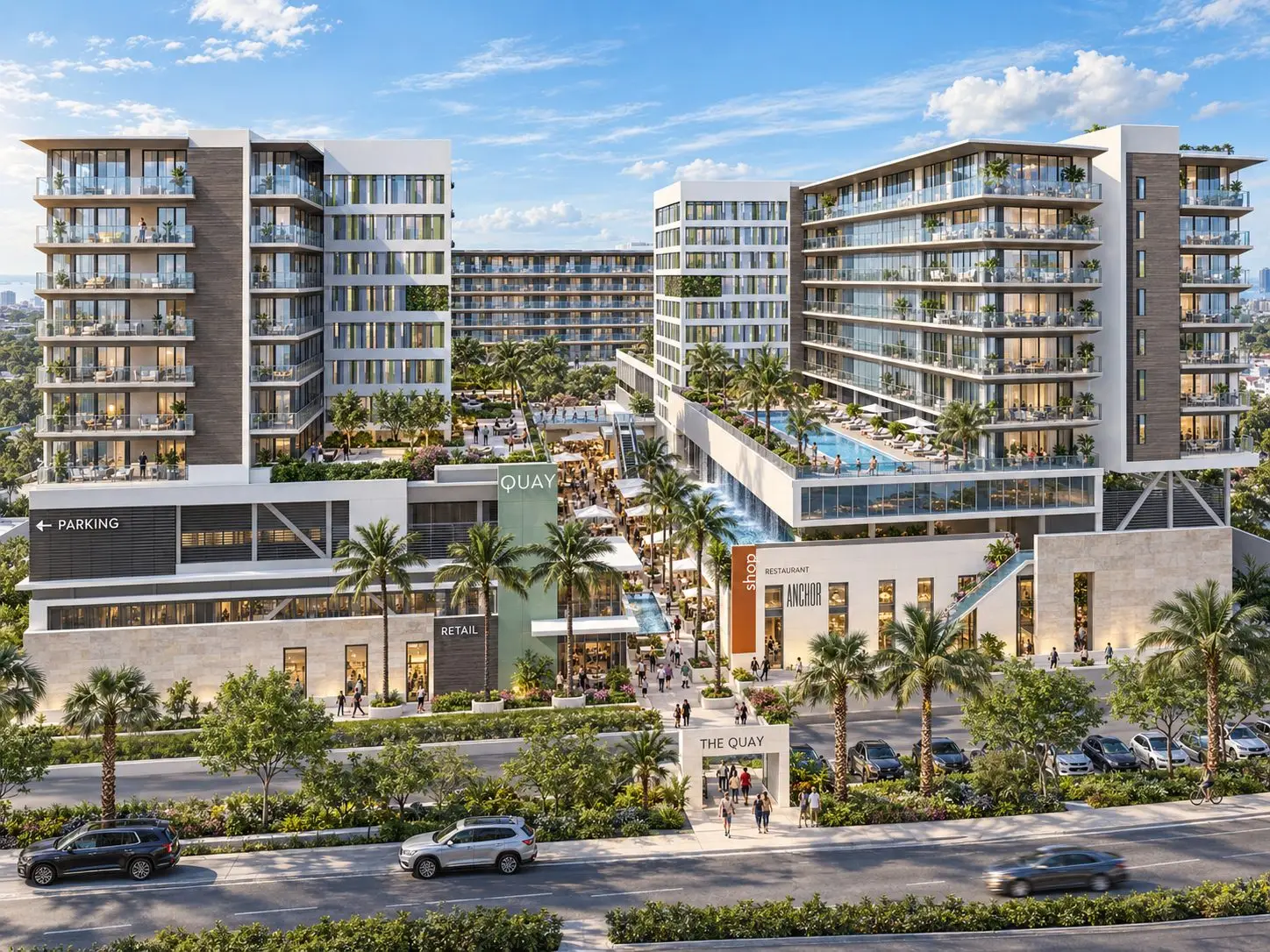 Conceptual rendering of The Quay, a mixed-use development featuring residential towers, elevated pool decks, retail, restaurants, and a central pedestrian promenade lined with palm trees.