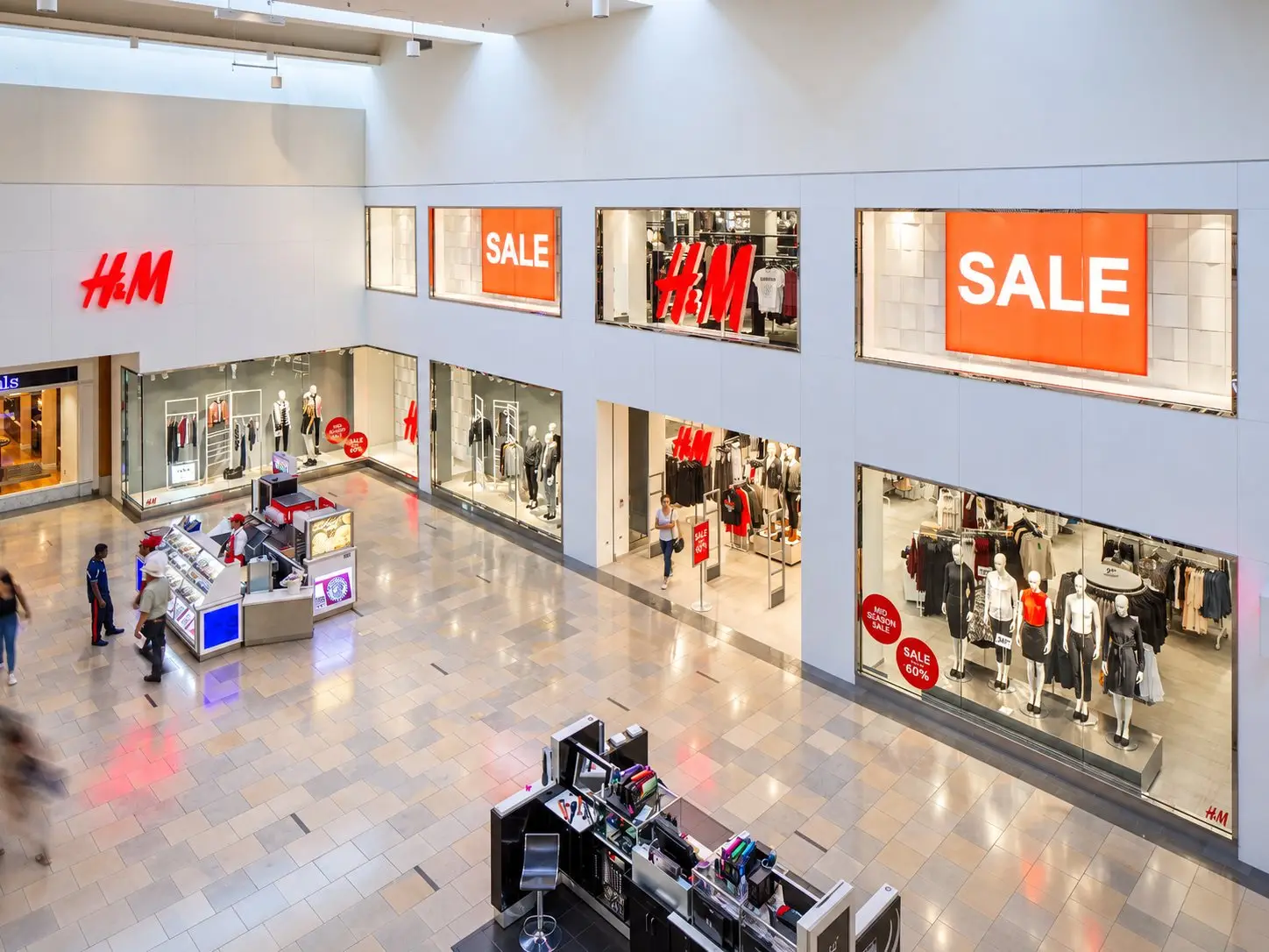 H&M two-story storefront at North Star Mall in San Antonio, Texas, with upper Sale windows, ground-floor displays, and the mall court in the foreground.